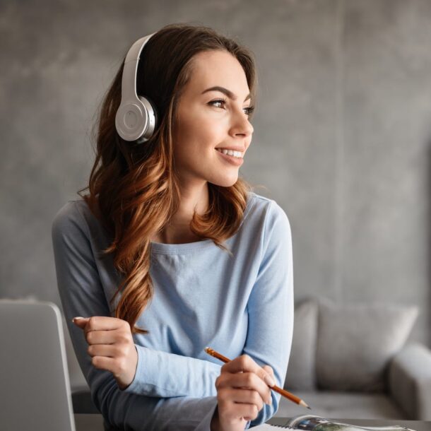 portrait-of-a-pretty-young-woman-in-headphones-PAUMKWS
